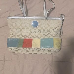 Vintage authentic Coach bag. Multi-color.  Shows signs of wear on outside.